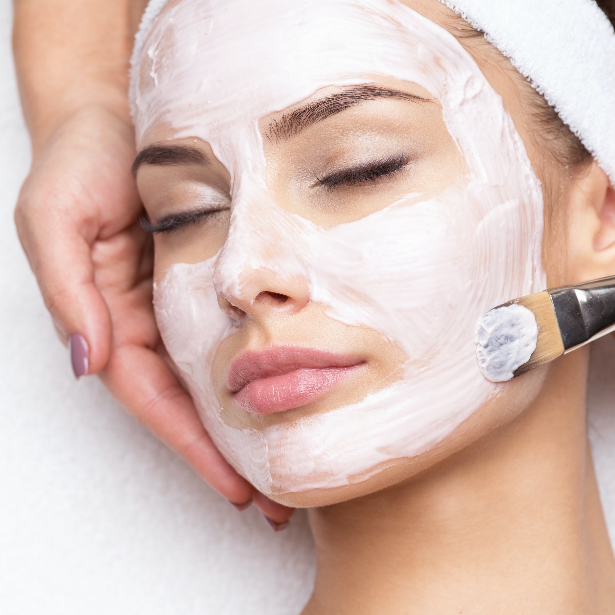 woman-receiving-facial-mask-at-beauty-salon.jpg